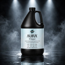 Aurà Whisper bottle in a dramatic stage lighting and haze environment.