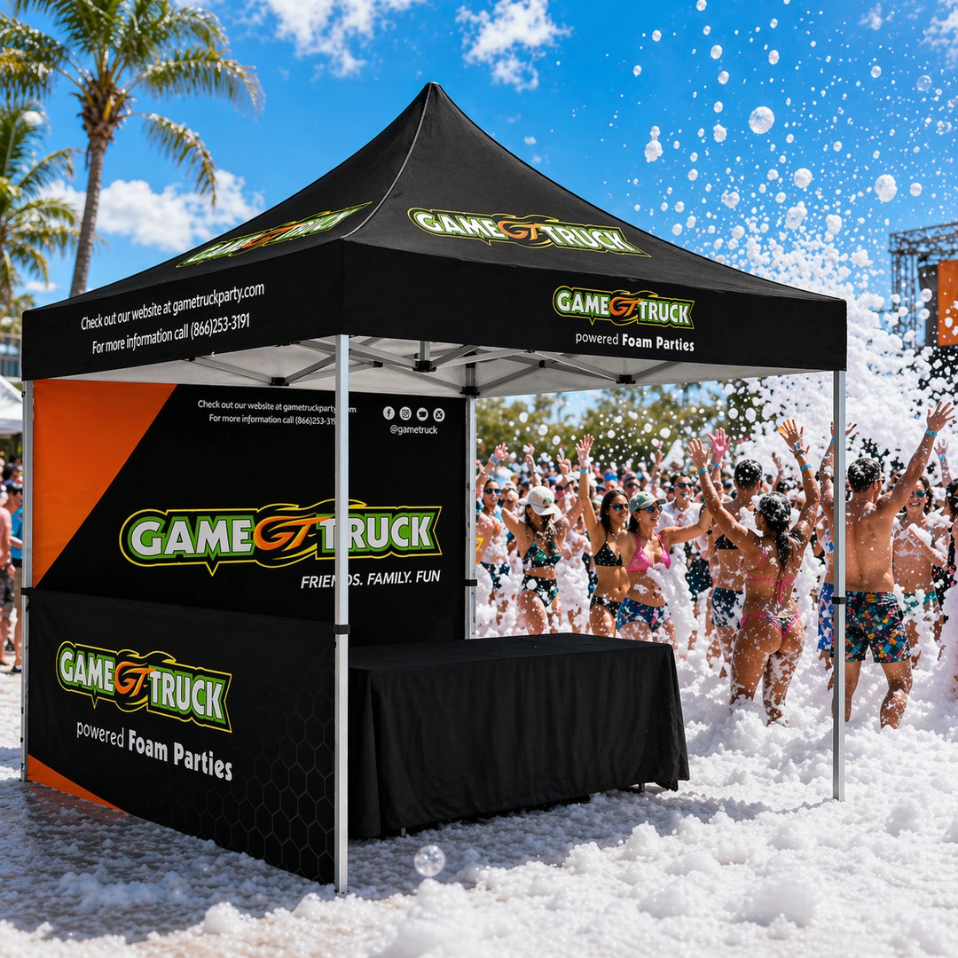 GameTruck branded tent with people playing in foam at a party.