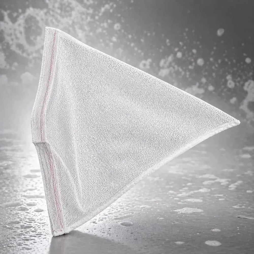 White triangular cloth on a textured gray background